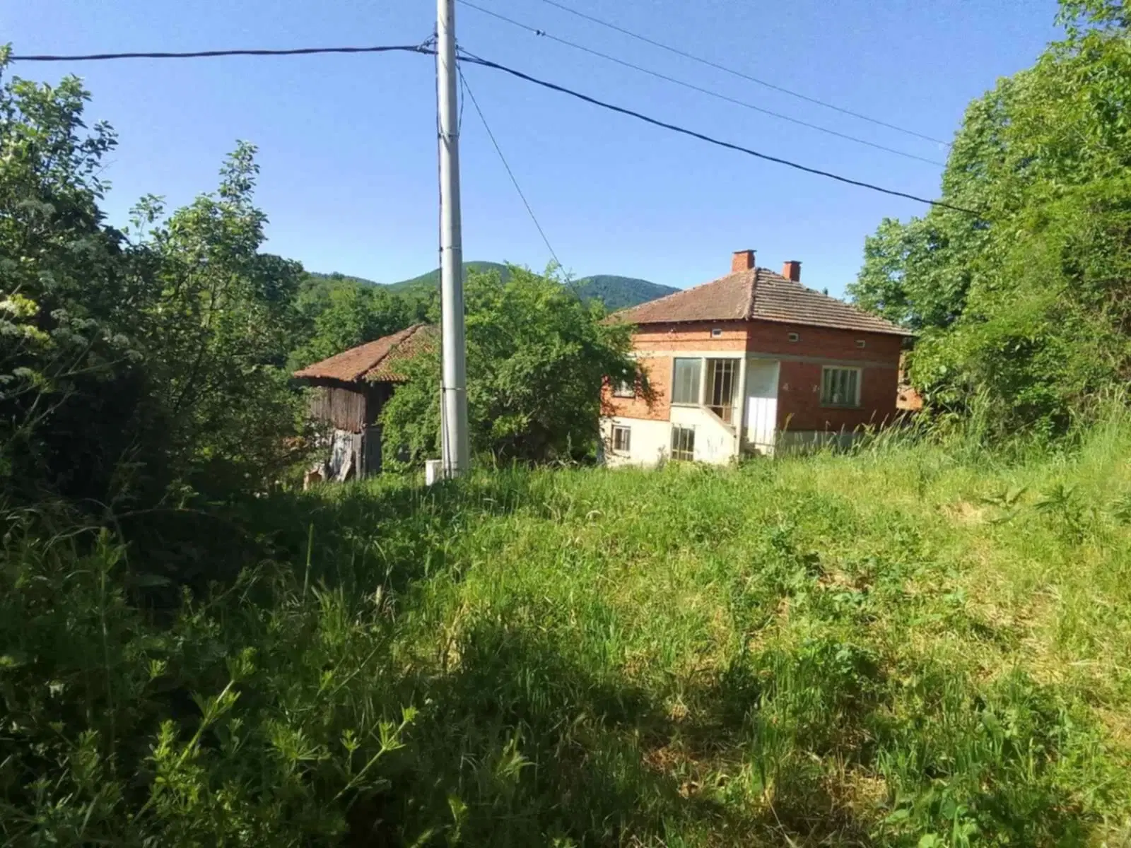 Eigendom aan de rivier met 2 huizen, bijgebouw en 1.100 m² grond in Podgore, Vidin - Bulgarije